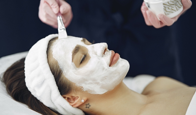 Facial being performed on client
